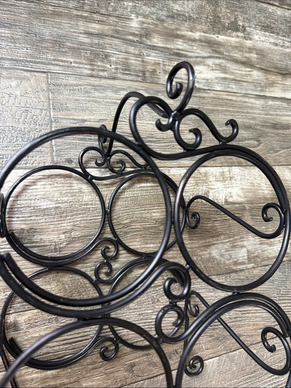 Decorative Black Metal Wall Wine Shelf - 4-Bottle Scroll Design